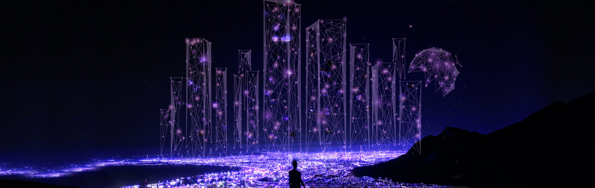 Glowing lights surrounded by darkness with person standing in the middle